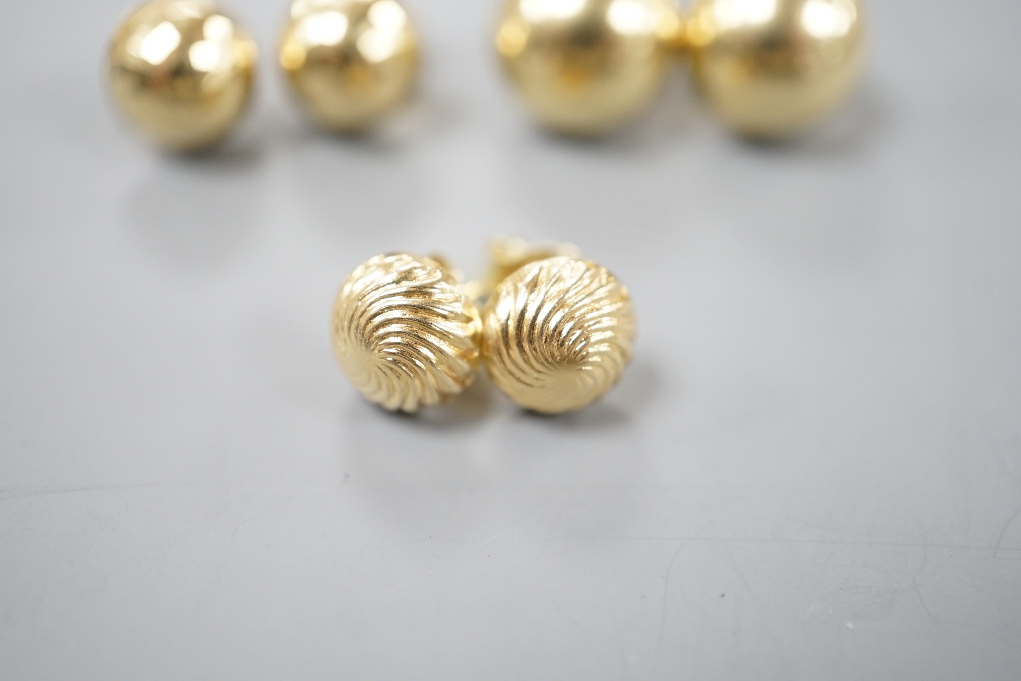 Two modern pairs of 750 yellow metal ear studs, one with 925 butterflies, gross 7.3 grams and a pair of 585 ear studs 2.3 grams.